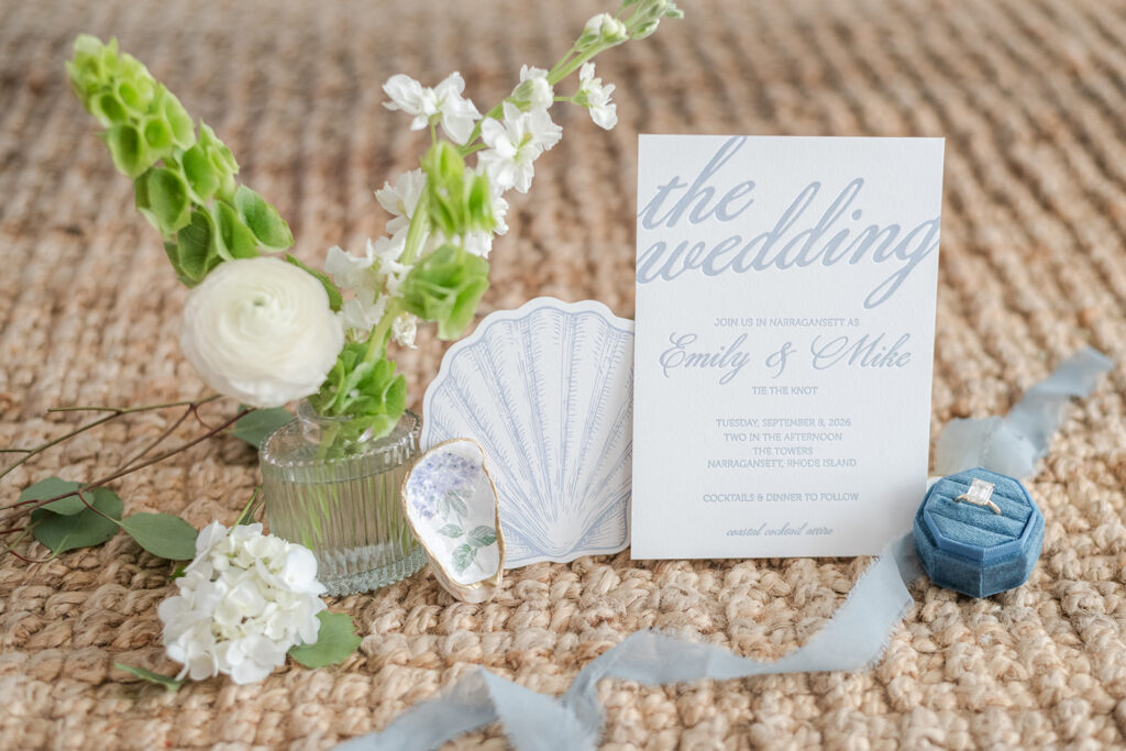 Coastal wedding invitation with a custom shell-shaped RSVP card in soft blue and white